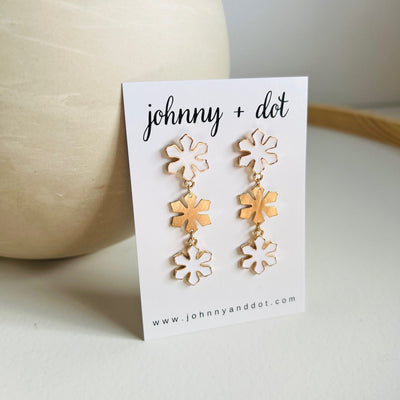 White and Brushed Gold Snowflake Dangle Earrings